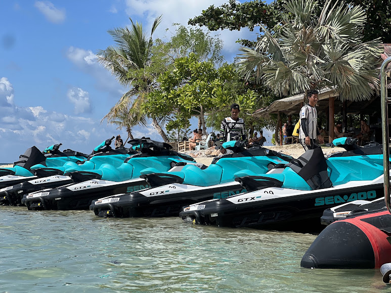 SunJetski Sea-Doo jet skis moored at an island stop near Koh Samui